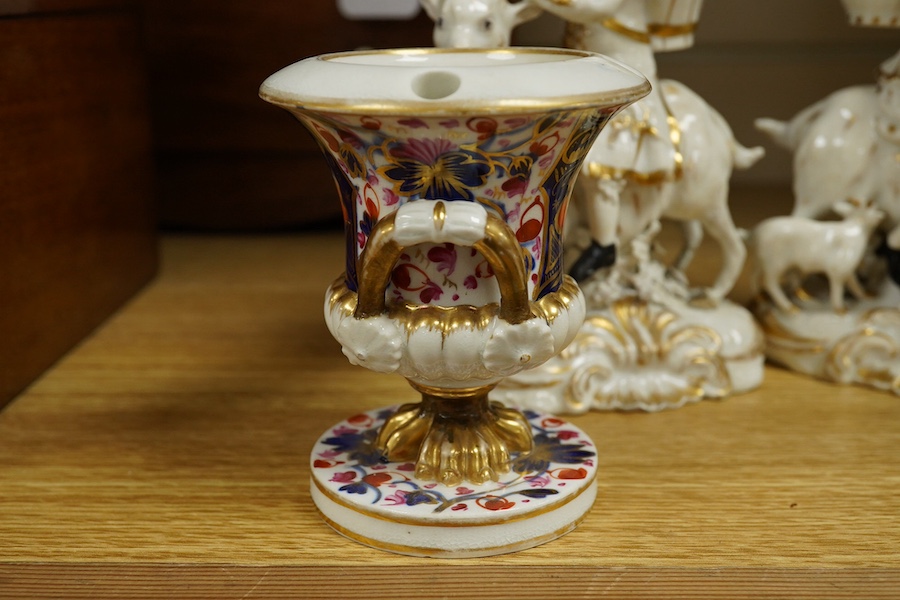 A pair of Bloor Derby white and gilt porcelain figures, Tailor and his Wife, together with a pair of small Imari pattern campaign spill vases, largest 14cm high. Condition - some restoration